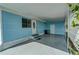 Light blue mobile home exterior with covered carport and small yard at 356 Longwood Dr, Venice, FL 34285