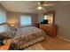 This bedroom is furnished with a bed, dresser with a mirror, and a ceiling fan at 356 Longwood Dr, Venice, FL 34285