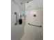 Walk-in shower with grab bars and tiled walls at 356 Longwood Dr, Venice, FL 34285