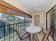 Spacious screened balcony overlooks a lush green landscape at 380 Three Lakes Ln # F, Venice, FL 34285