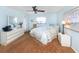 Light and airy bedroom with a ceiling fan and neutral decor at 380 Three Lakes Ln # F, Venice, FL 34285
