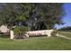 Mission Lakes community entrance with lush landscaping at 380 Three Lakes Ln # F, Venice, FL 34285