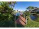 Community boardwalk leads to a peaceful canal at 380 Three Lakes Ln # F, Venice, FL 34285