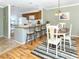 Bright kitchen with granite countertops and wood cabinets at 380 Three Lakes Ln # F, Venice, FL 34285