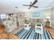 Spacious living room featuring light flooring and comfy seating at 380 Three Lakes Ln # F, Venice, FL 34285
