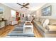 Bright living room with hardwood floors and comfy seating at 380 Three Lakes Ln # F, Venice, FL 34285