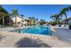 Inviting community pool with plenty of lounge chairs at 380 Three Lakes Ln # F, Venice, FL 34285
