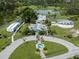 Aerial view of park with buildings and pond at 4081 Roderigo Ave, North Port, FL 34286