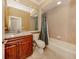 Well-appointed bathroom with granite countertop, wood cabinets, and bathtub at 4081 Roderigo Ave, North Port, FL 34286