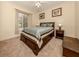 Spacious bedroom with wood platform bed, nightstands, and ample closet space at 4081 Roderigo Ave, North Port, FL 34286