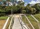 Metal walkway leads to floating dock for boats at 4081 Roderigo Ave, North Port, FL 34286