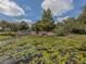 Community entrance features a welcoming sign and serene water feature at 4081 Roderigo Ave, North Port, FL 34286