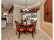 Bright dining area with table and chairs, overlooking the pool at 4081 Roderigo Ave, North Port, FL 34286