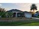 Beautiful home with a well-maintained lawn and manicured landscaping at 4081 Roderigo Ave, North Port, FL 34286