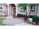 Inviting front entry with brick pavers, landscaping, and a stately entrance at 4081 Roderigo Ave, North Port, FL 34286
