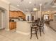 Kitchen with breakfast bar and view into dining area at 4081 Roderigo Ave, North Port, FL 34286