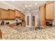 Spacious kitchen with granite countertops and light wood cabinets at 4081 Roderigo Ave, North Port, FL 34286