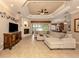 Spacious living room with a large sectional sofa and fireplace at 4081 Roderigo Ave, North Port, FL 34286