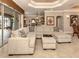 Relaxing living room with large sectional sofa and tray ceiling at 4081 Roderigo Ave, North Port, FL 34286
