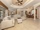 Spacious living room featuring a sectional sofa and high ceilings at 4081 Roderigo Ave, North Port, FL 34286
