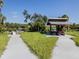 Relaxing park with covered picnic area, dock, and walking paths at 4081 Roderigo Ave, North Port, FL 34286