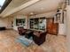 Covered patio with comfortable seating and a view of the pool at 4081 Roderigo Ave, North Port, FL 34286