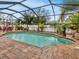 Enjoy this refreshing pool with a screened enclosure and plenty of seating at 4081 Roderigo Ave, North Port, FL 34286
