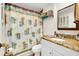 Clean bathroom with granite countertop and shower at 411 Circlewood Dr # I2, Venice, FL 34293
