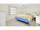 Spacious main bedroom with king-size bed and light flooring at 411 Circlewood Dr # I2, Venice, FL 34293