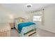Cozy bedroom featuring a comfortable bed and window at 411 Circlewood Dr # I2, Venice, FL 34293