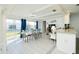 Spacious dining area with backyard access and seating for six at 411 Circlewood Dr # I2, Venice, FL 34293