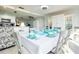 Elegant dining room featuring a table set for six at 411 Circlewood Dr # I2, Venice, FL 34293