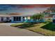 Charming single story home with teal accents and well-manicured lawn at 411 Circlewood Dr # I2, Venice, FL 34293