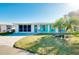 Bright and airy home exterior with a lush green lawn at 411 Circlewood Dr # I2, Venice, FL 34293