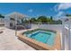 Relaxing hot tub with covered patio area at 411 Circlewood Dr # I2, Venice, FL 34293