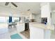 Modern kitchen with stainless steel appliances and granite countertops at 411 Circlewood Dr # I2, Venice, FL 34293