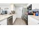 Modern kitchen with stainless steel appliances and granite countertops at 411 Circlewood Dr # I2, Venice, FL 34293
