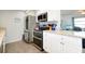 Modern kitchen with stainless steel appliances and granite countertops at 411 Circlewood Dr # I2, Venice, FL 34293