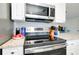 Modern kitchen features stainless steel appliances and granite countertops at 411 Circlewood Dr # I2, Venice, FL 34293
