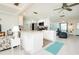 Open concept kitchen with breakfast bar and island at 411 Circlewood Dr # I2, Venice, FL 34293
