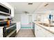 Kitchen with stainless steel appliances and granite countertops at 411 Circlewood Dr # I2, Venice, FL 34293