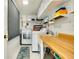 Bright laundry room with washer, dryer, and ample storage at 411 Circlewood Dr # I2, Venice, FL 34293