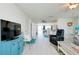 Open concept living space with light floors and a view to the kitchen at 411 Circlewood Dr # I2, Venice, FL 34293