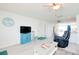 Relaxing living room with comfy seating and light flooring at 411 Circlewood Dr # I2, Venice, FL 34293