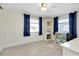 Home office featuring a desk, shelving, and window with curtains at 411 Circlewood Dr # I2, Venice, FL 34293