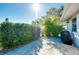 Cozy patio area with brick pavers and a covered grill at 411 Circlewood Dr # I2, Venice, FL 34293