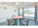 Bright sunroom with a table and chairs, creating a relaxing space at 411 Circlewood Dr # I2, Venice, FL 34293