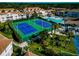 Aerial view of community with tennis courts, pool, and lush landscaping at 4200 Castlebridge Ln # 1924, Sarasota, FL 34238