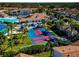 Aerial view of community amenities including shuffleboard at 4200 Castlebridge Ln # 1924, Sarasota, FL 34238
