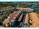 Aerial view of community with lake and parking at 4200 Castlebridge Ln # 1924, Sarasota, FL 34238